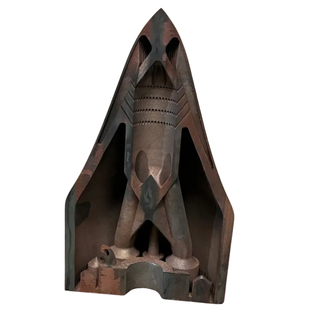 Sectioned rocket shaped part revealing internal passages and chambers printed in one piece